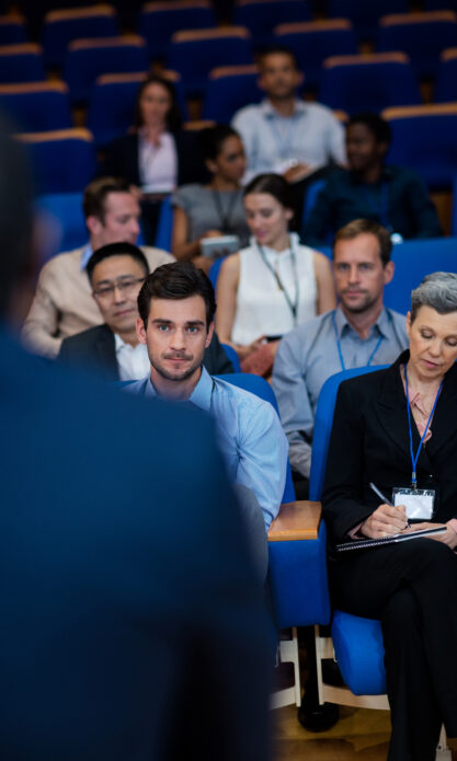 Business executives participating in a business meeting at conference center