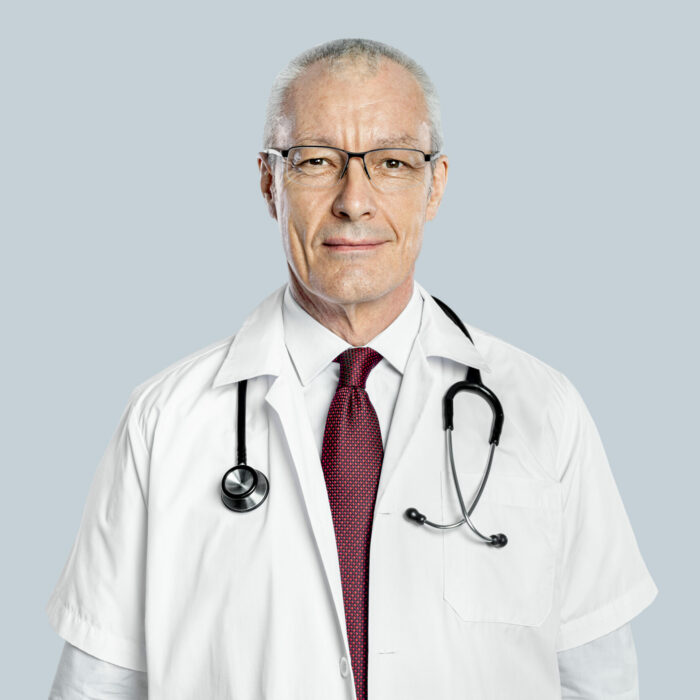Cheerful male doctor in a white gown portrait