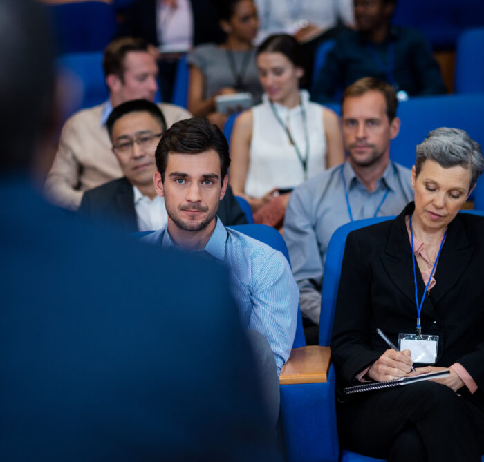 Business executives participating in a business meeting at conference center