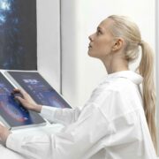 side-view-woman-working-digital-monitors